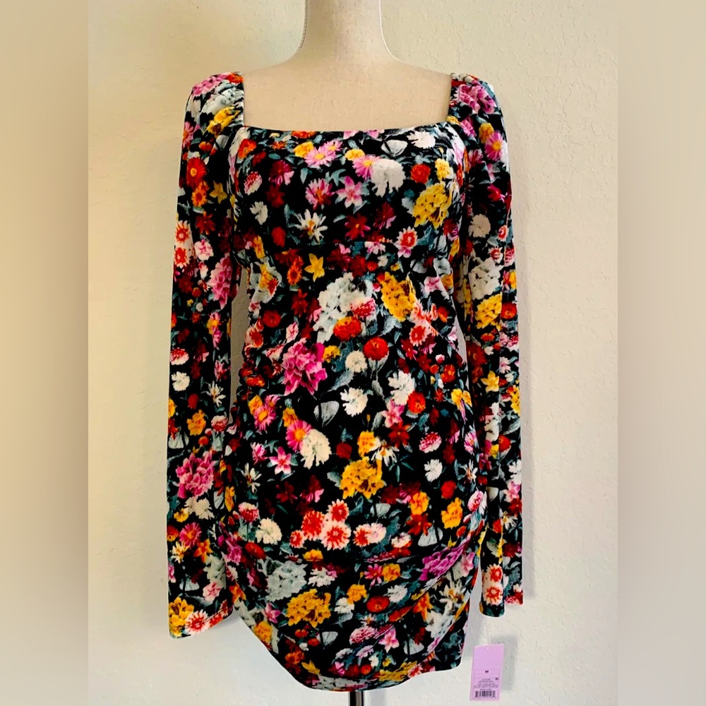 Size medium long sleeved ruched mini dress.